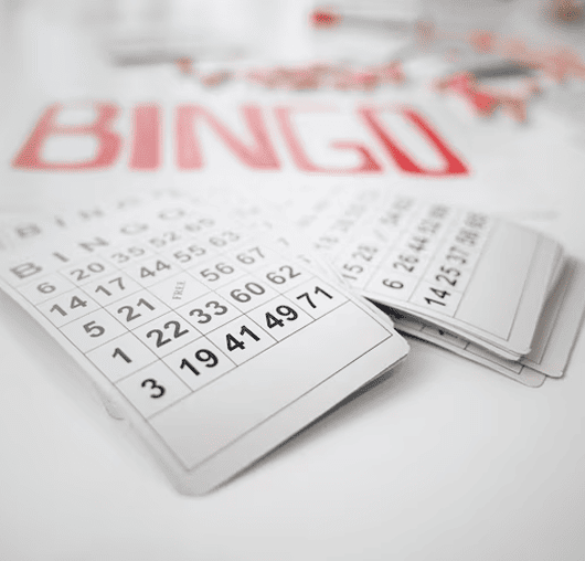 Bingo card and pen on a white background